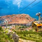 Old town of Dubrovnik with cable car ascending Srd mountain, Dalmatia, Croatia